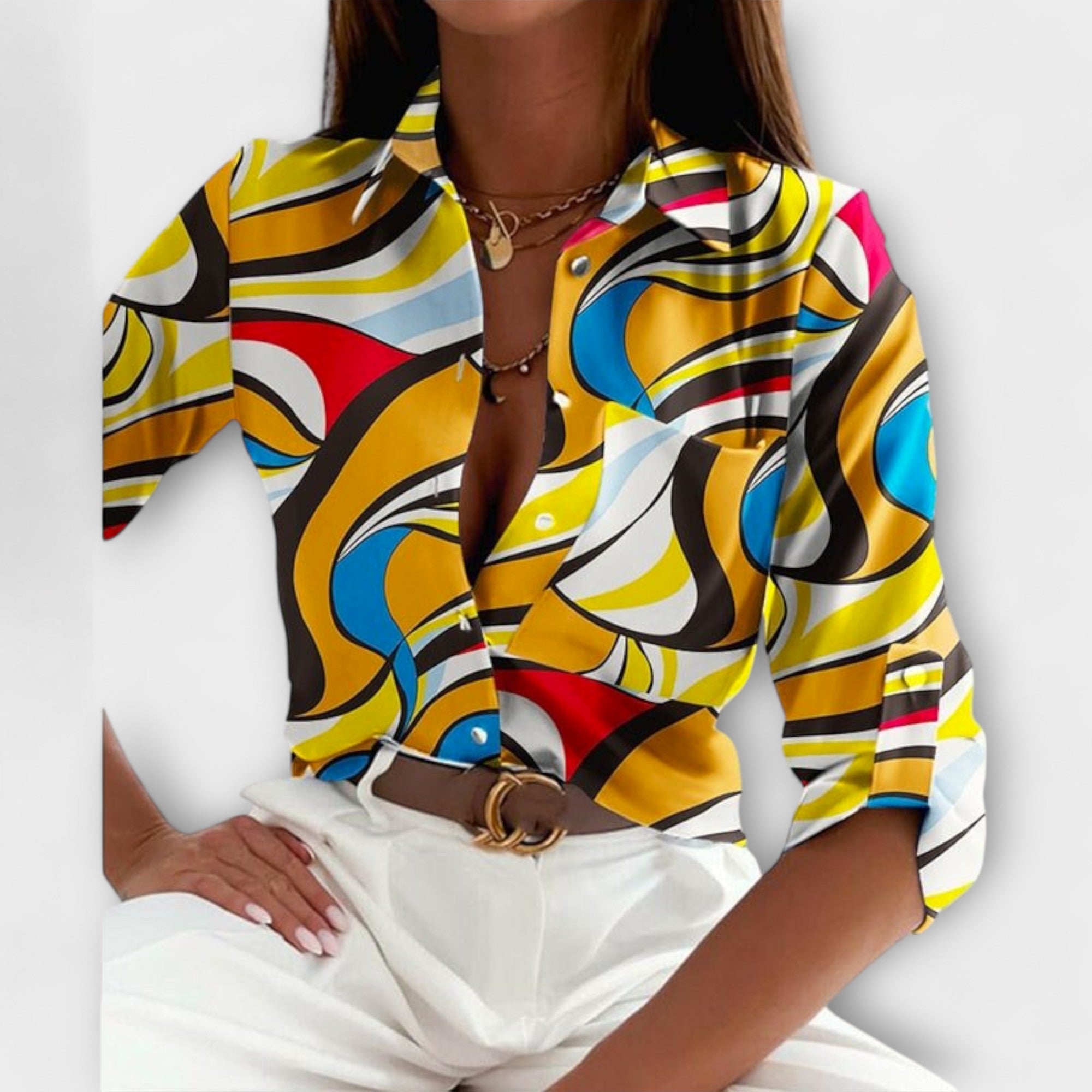 Classic-collar blouse with yellow, blue, and red abstract swirls, button front.