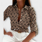 Classic collar button-front blouse with black-and-cream geometric pattern and long sleeves