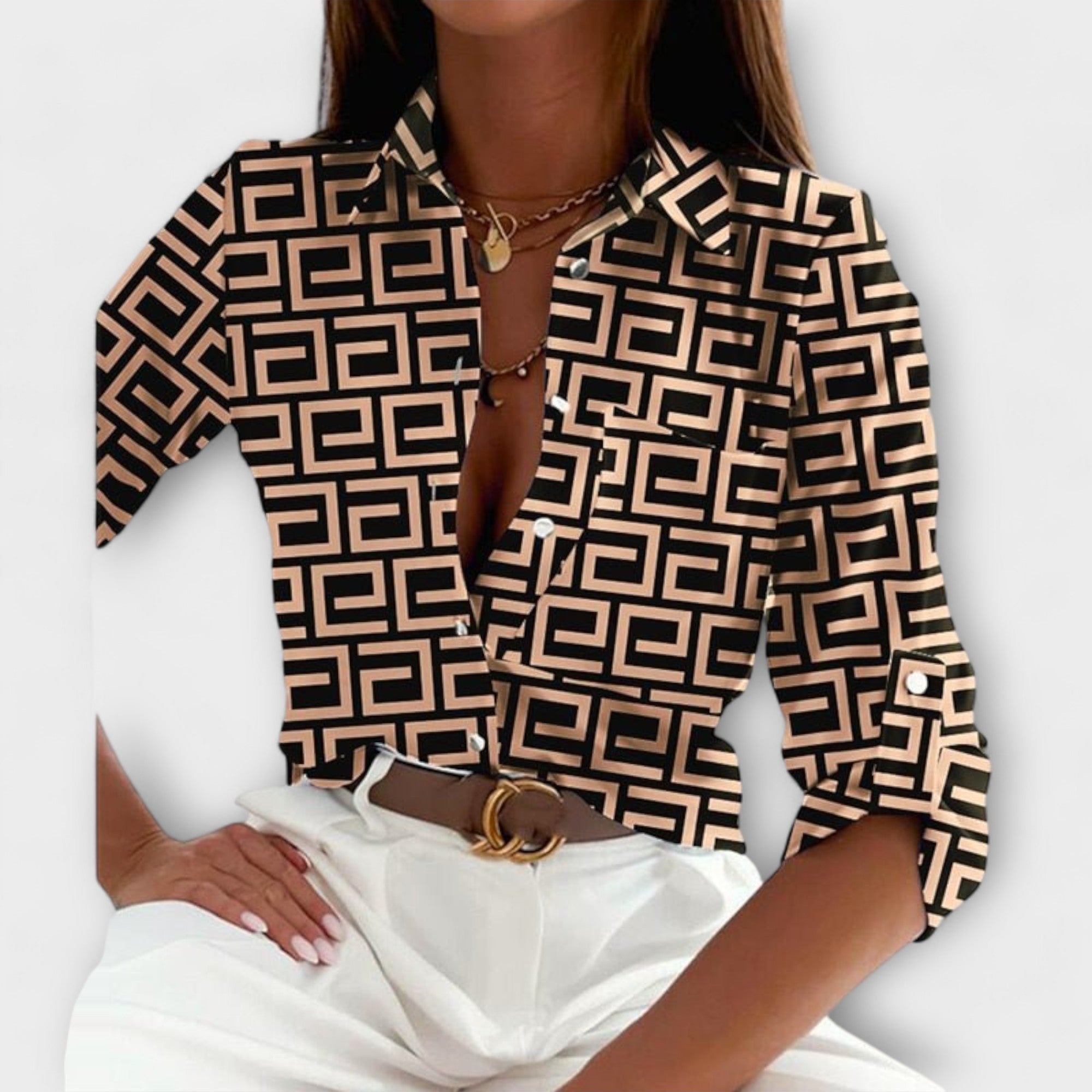 Classic collar button-front blouse with black-and-cream geometric pattern and long sleeves