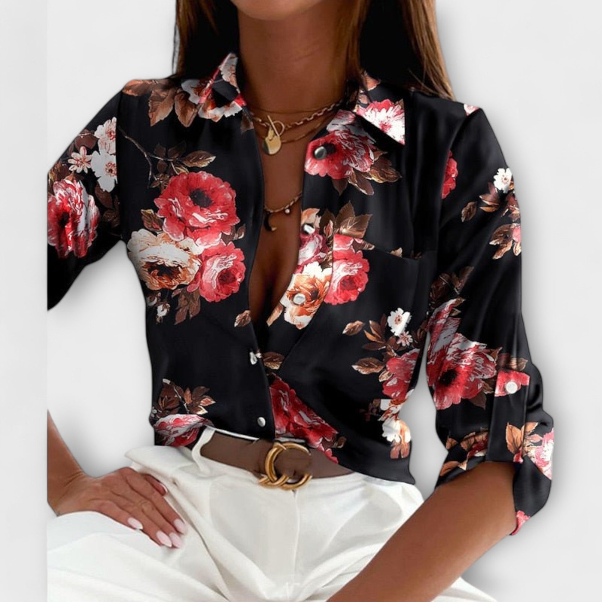 Classic-collar blouse in black with red and white floral print, button front.