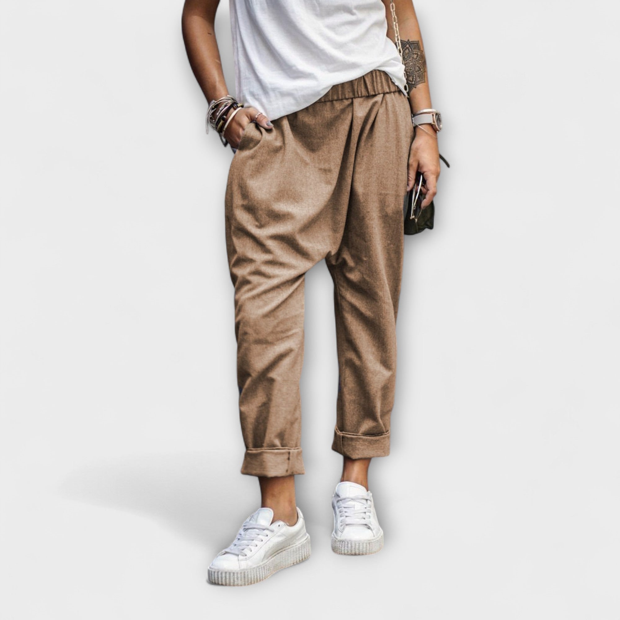 Khaki brown wide-leg pants with cuffed ankles and gathered waist.