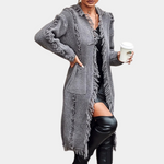 Gray knit cardigan with long fringe, open front, patch pockets and tassel trim