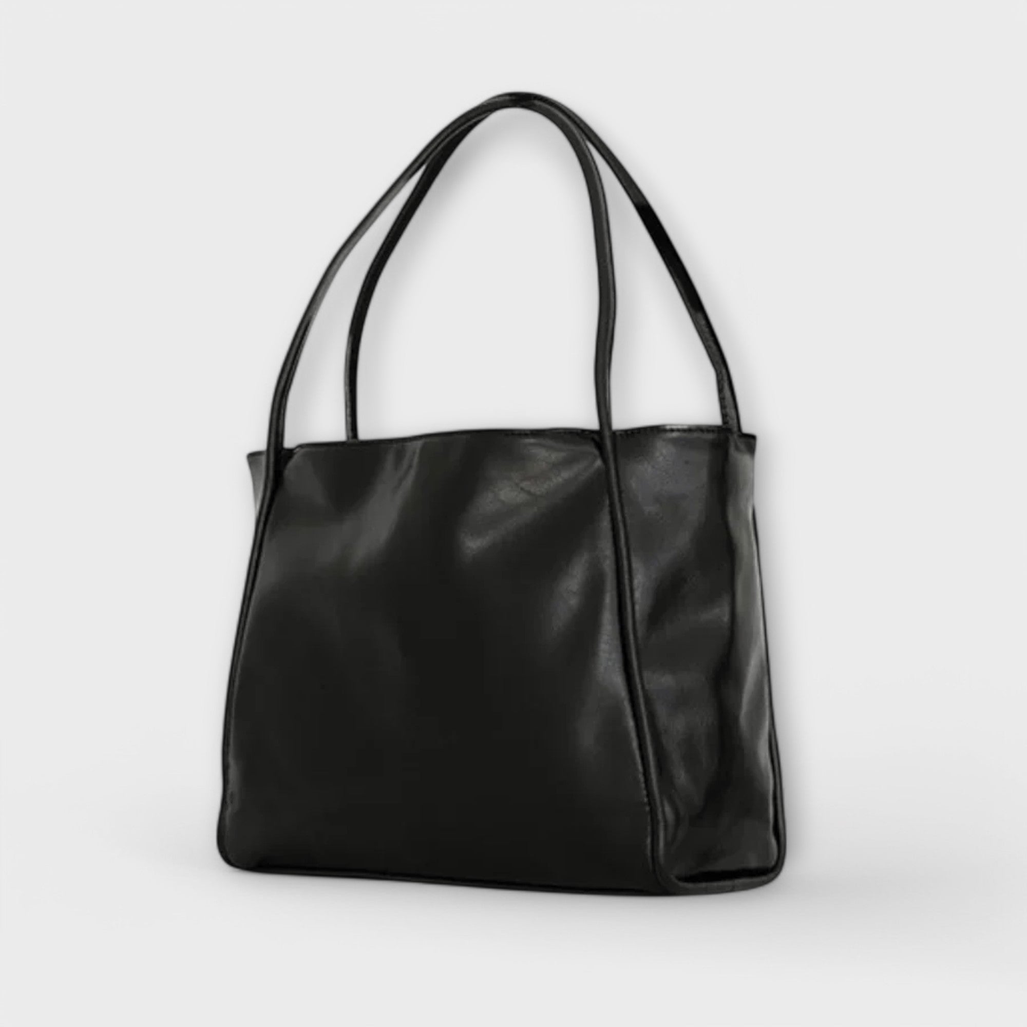 Black leather-look tote bag with two handles and smooth front panel